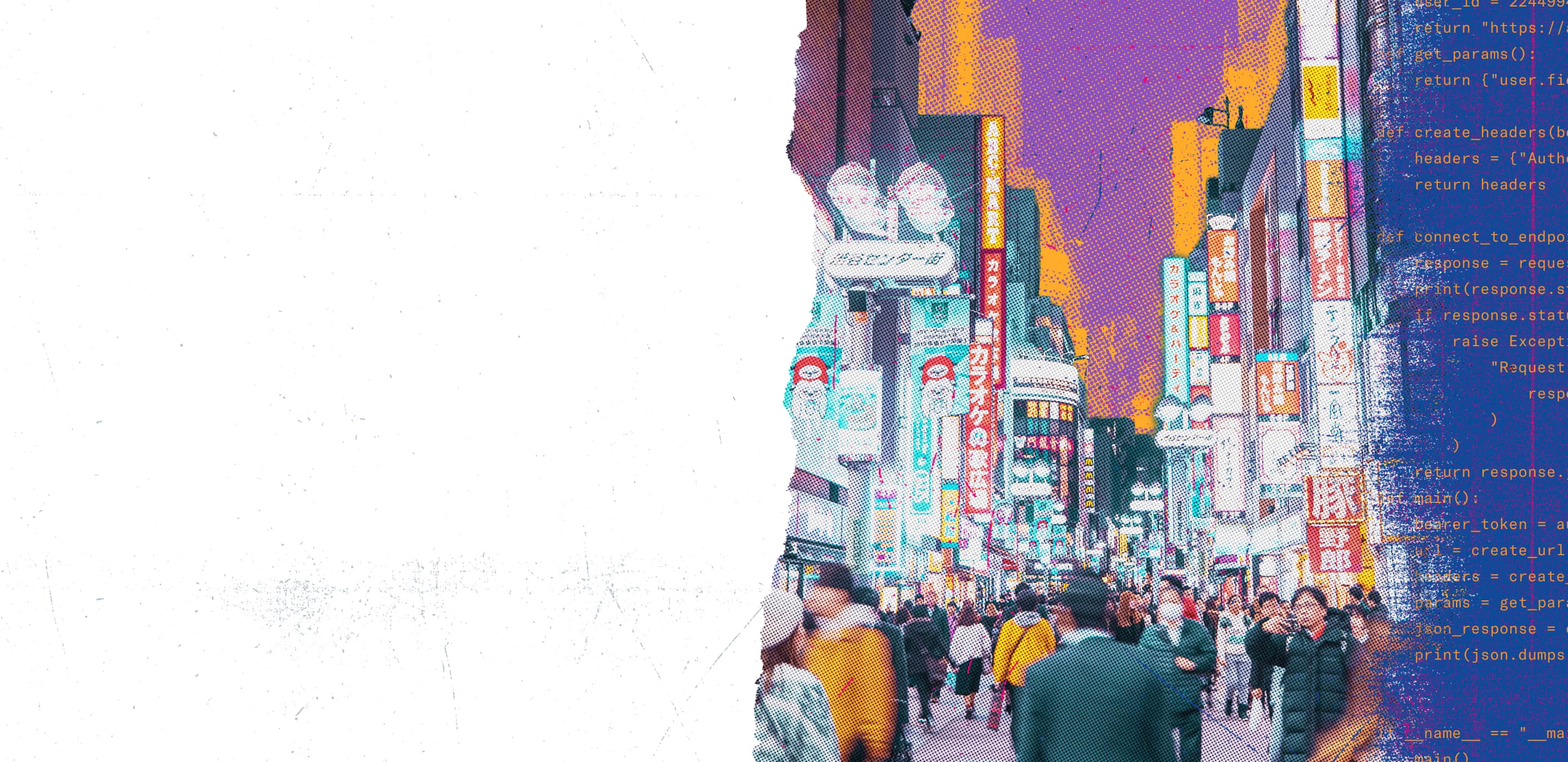 Busy downtown street with tall buildings and neon signs